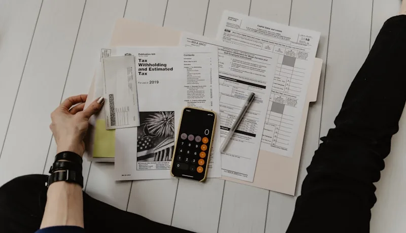 Identity and income documents laid out for a tenant dossier